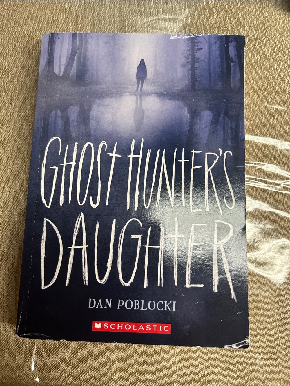 Scholastic Ghost Hunter's Daughter — Deep Blue and White Cover